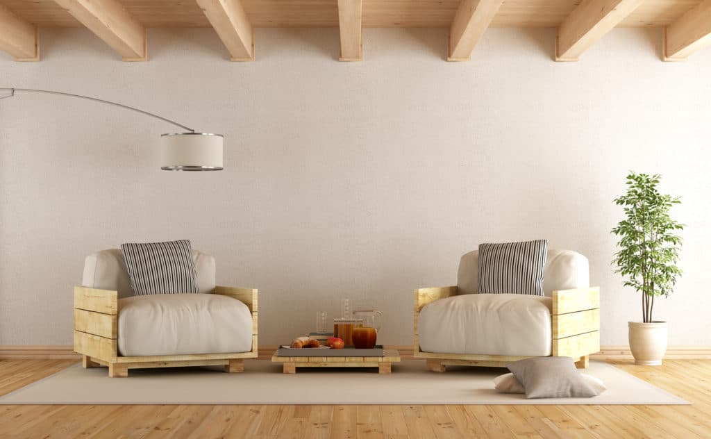 Modern living room with pallet armchairs and coffee table - 3D Rendering